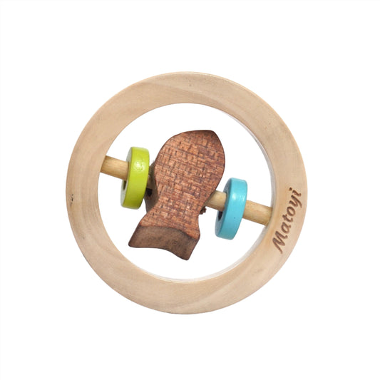 Wooden toy shaped like a fish with a blue body and green tail on a white background. This colorful rattle is designed for infants and helps stimulate visual development and grasping skills.
